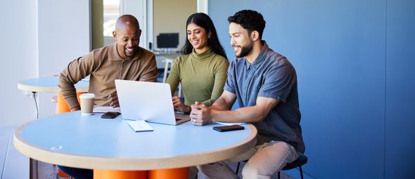 group of diverse businesspeople working on a laptop