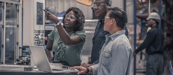 Workers talking in factory