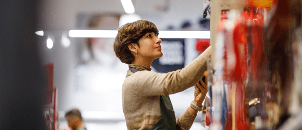 A worker stocking shelves at a store.